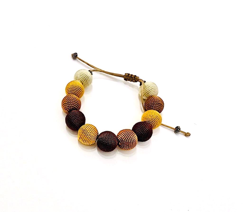 <transcy>Bracelet - ocher shades - Vegetable cactus silk - Passementerie</transcy>